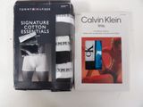 two boxes of calvin klein underwear on a table