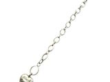 a close up of a silver bracelet with a heart on it