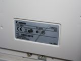 a close up of a canon printer on a white surface