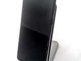 a cell phone that is sitting on top of a stand