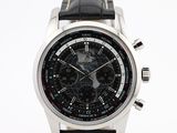 a close up of a watch on a white surface