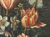 painting of flowers in a glass vase on a wooden surface