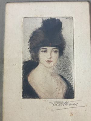 an old picture of a woman with a feathered hat in a frame