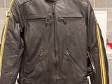 a picture of a leather jacket on display in a store