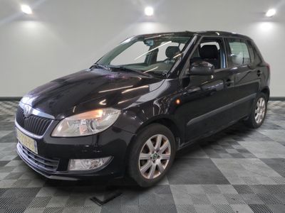 a picture of a small black car parked in a garage
