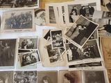 several old photographs of people are displayed on a table