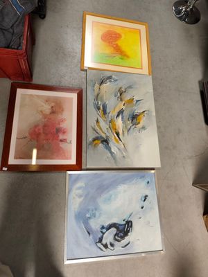 three paintings on the floor next to each other