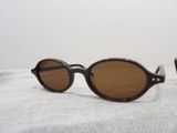 a pair of sunglasses sitting on a white surface