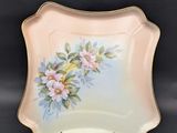 an image of a plate with flowers painted on it