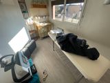 a table with a bag on it in a room