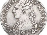 une pièce en argent avec l'image d'une femme de profil