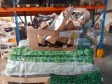 a large pile of boxes of assorted items in a warehouse