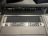 a sound board with a lot of knobs on it