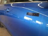 a blue car with a sticker that says tatoo on it