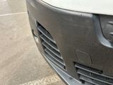 a close up of a car ' s front grill and bumper