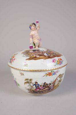 an image of a porcelain bowl with a figurine on top of it