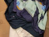 a cardboard box filled with clothes and other items
