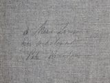 a close up of a book with a handwriting on it