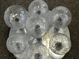 a white plate with a bunch of glass balls on it