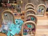 a lot of earrings on display on a wooden table