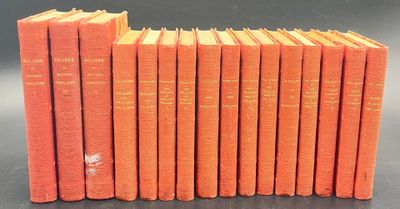 six orange books stacked on top of each other on a table