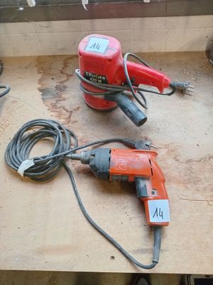 two electric tools that are on a table
