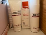 many different types of skin care products sitting on a counter