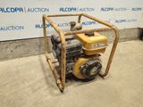 a close up of a small engine on a cart in front of a wall