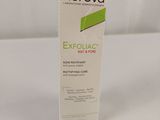 a close up of a tube of exfoliac cream on a white surface