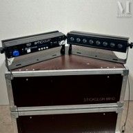 two amps sitting on top of each other on a table