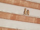 two teddy bears that are sitting on the stairs