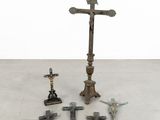 a lot of crosses on the floor next to each other