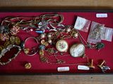 a display case with a lot of jewelry in it