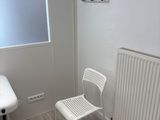 a white chair and a white table in a room