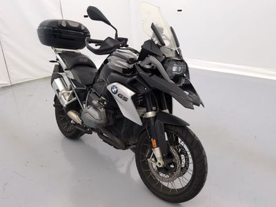 a black and white motorcycle parked in a white room