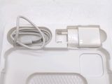 a white tray with a charger and a cable attached to it