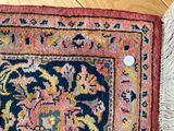 a close up of a rug on a wooden floor