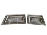 a pair of silver plated trays on a white background