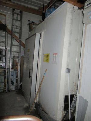 an image of a room with a refrigerator in it