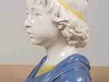 pair of porcelain busts of a boy and a girl