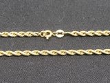 a close up of a chain on a black surface