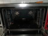 an open oven with the door open in a kitchen