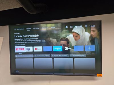 a large flat screen tv on the wall in the room