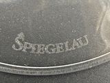 a close up of a glass plate with the name of the dish