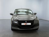 the front view of a grey car parked in a white room