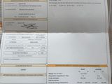a receipt sitting on top of a desk next to a keyboard
