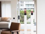 a living room with a couch, chair, coffee table and television