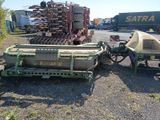a tractor and a trailer that is parked next to each other