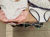 a lot of underwear on a shelf in a store