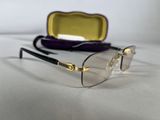 a close up of a pair of glasses on a table
